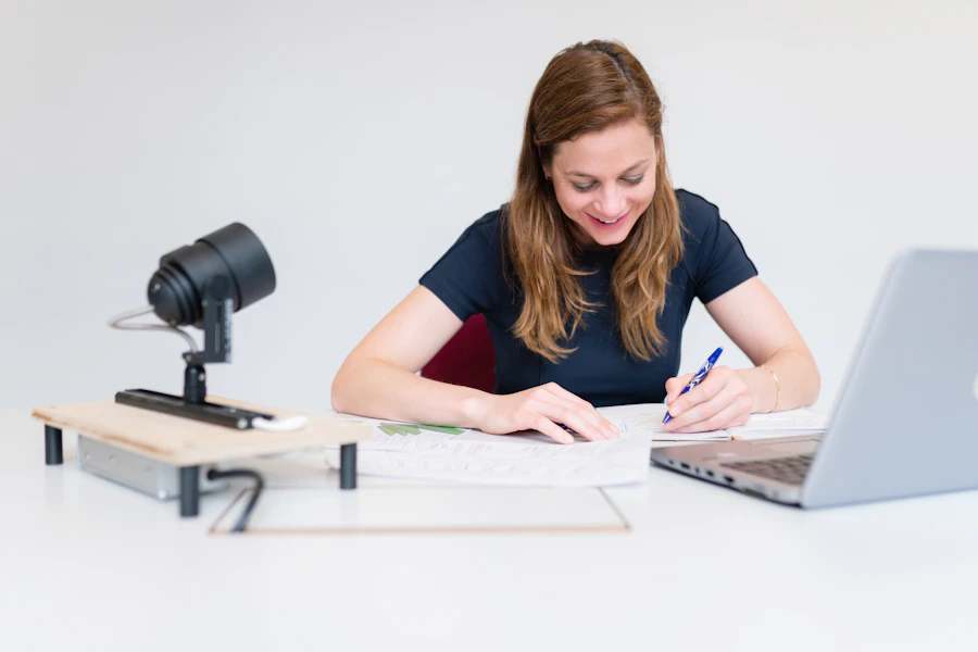 Woman studying notes at a desk